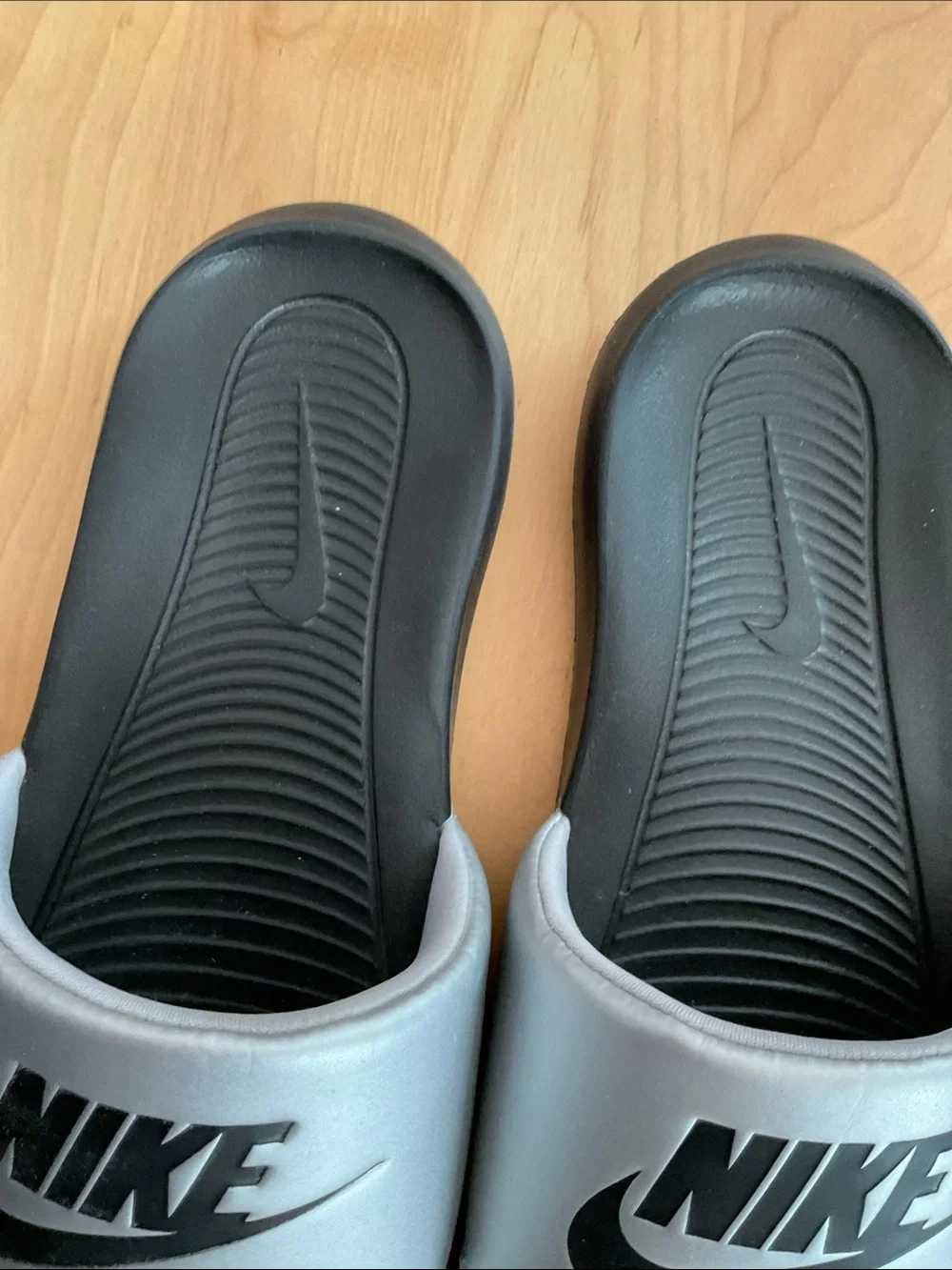 Nike Silver and Black Slide Sandals with Bold Logo
